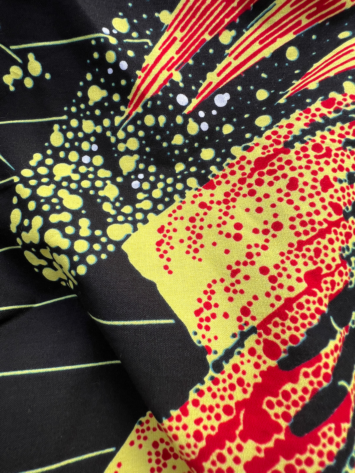 Ariya Adaze Shirt and Ariya Cotton Midi Skirt worn together as a set, in red and yellow Fireworks print Dutch wax cotton
