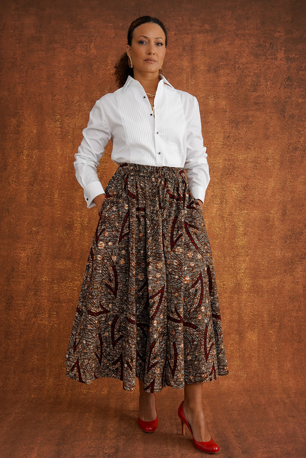 Chinaza printed cotton midi skirt worn with a white shirt, showing the full silhouette