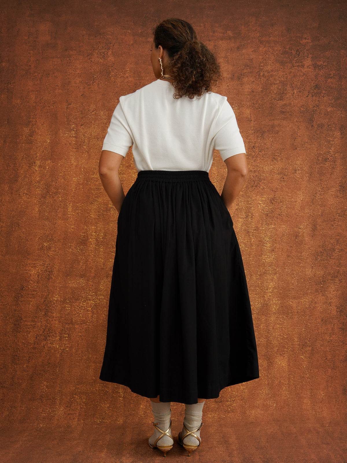 The Grand Skirt in Black, gathered midi skirt in textured dobby cotton with elasticated drawstring waist