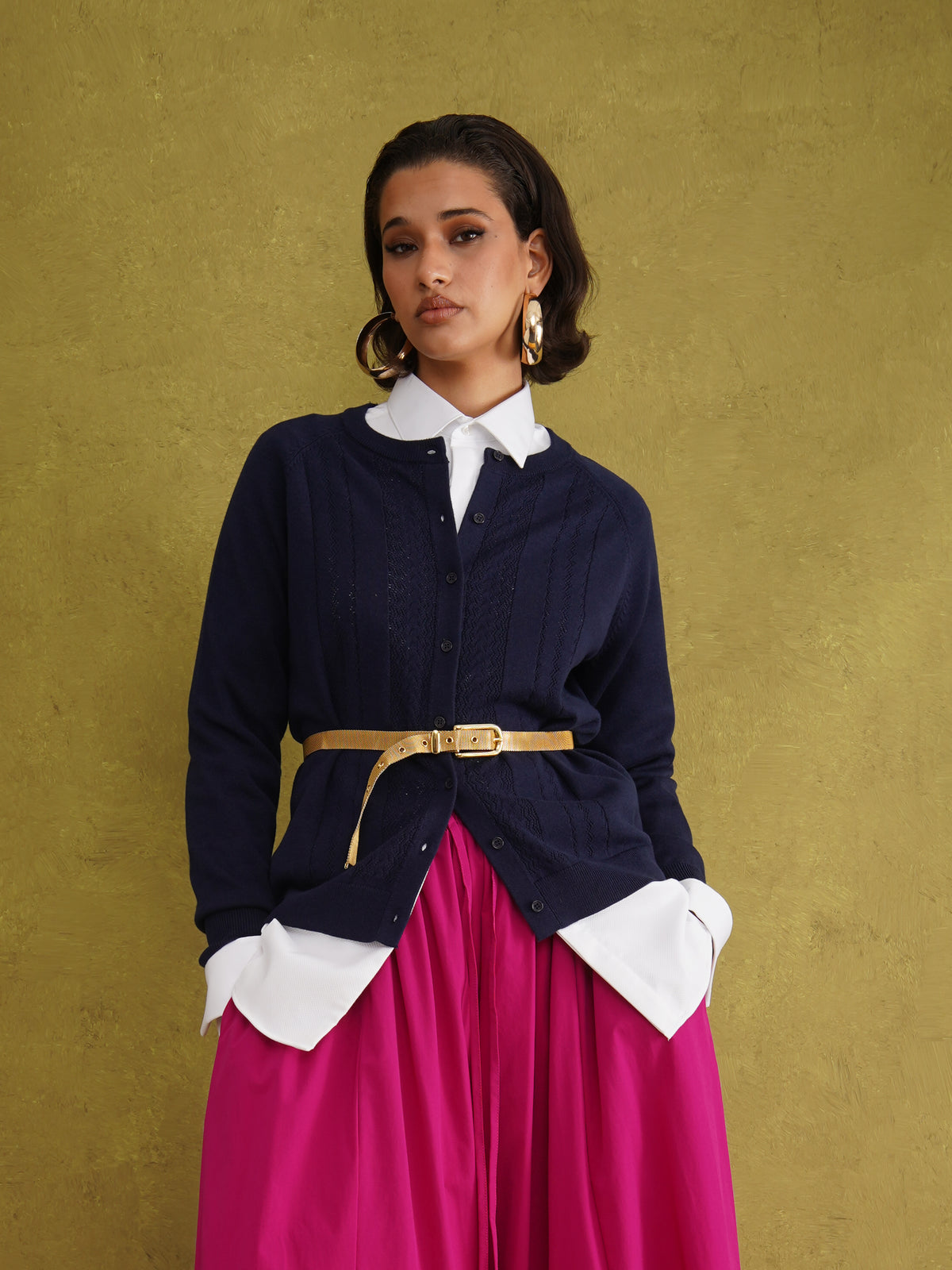 Titi Cardigan in Navy, a relaxed-fit navy knit cardigan with open-work and cable stitches and small buttons up to the neck