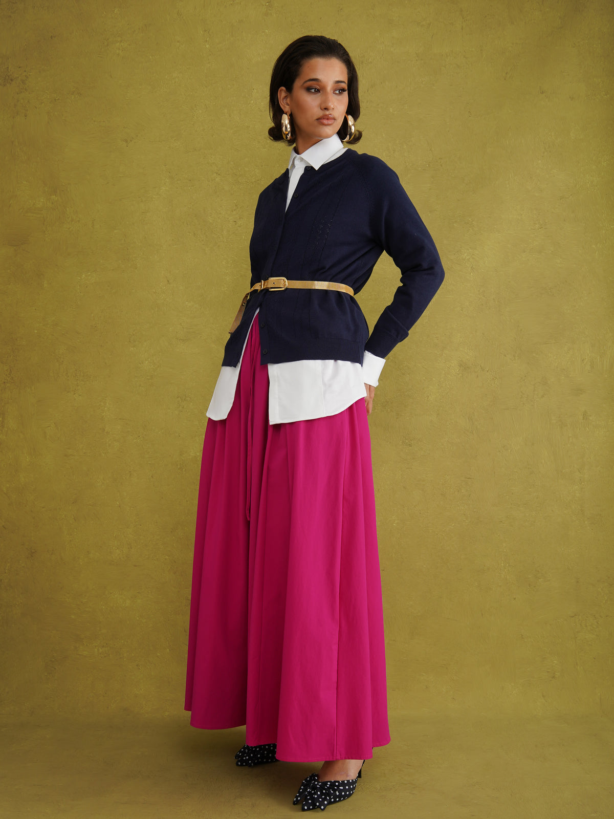 Titi Cardigan in Navy, a relaxed-fit navy knit cardigan with open-work and cable stitches and small buttons up to the neck