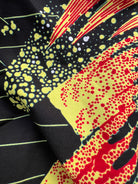 Ariya Adaze Shirt and Ariya Cotton Midi Skirt worn together as a set, in red and yellow Fireworks print Dutch wax cotton