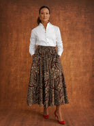 Front view of the Chinaza eight-panel skirt styled with a white shirt