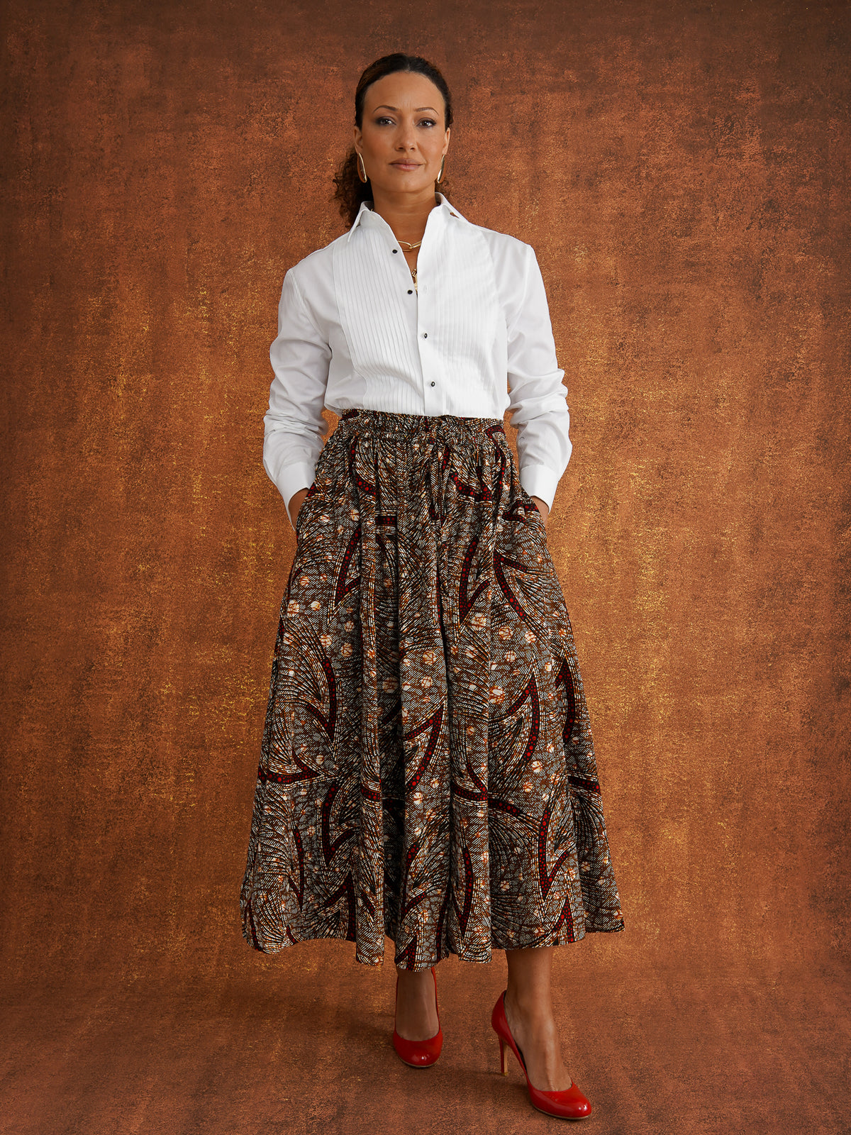 Front view of the Chinaza eight-panel skirt styled with a white shirt