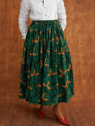 Close view of Tanna's gathered waist and green Dutch wax print