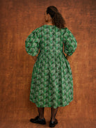 Megan Green Dress, back view showing cover buttons