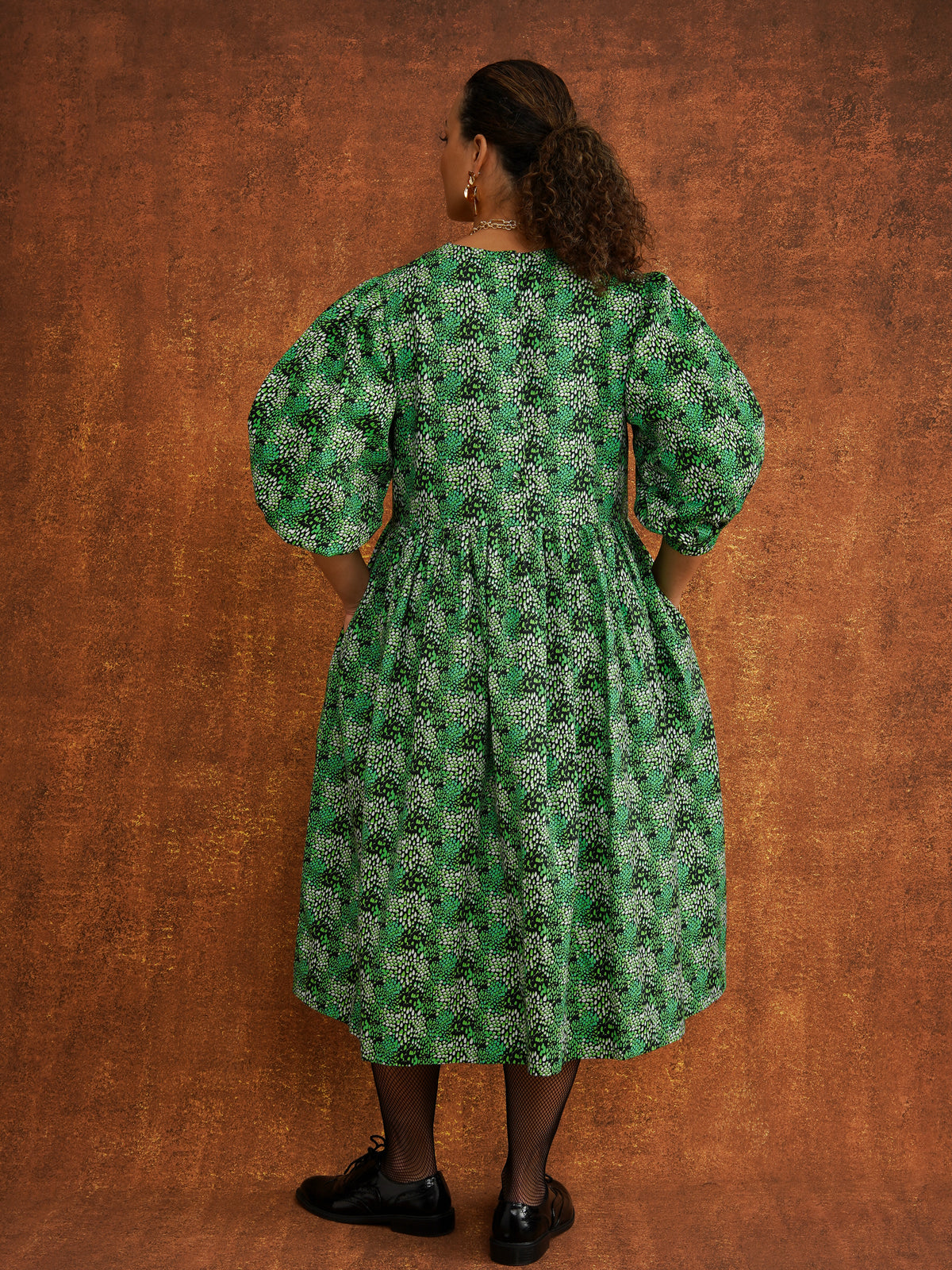 Megan Green Dress, back view showing cover buttons