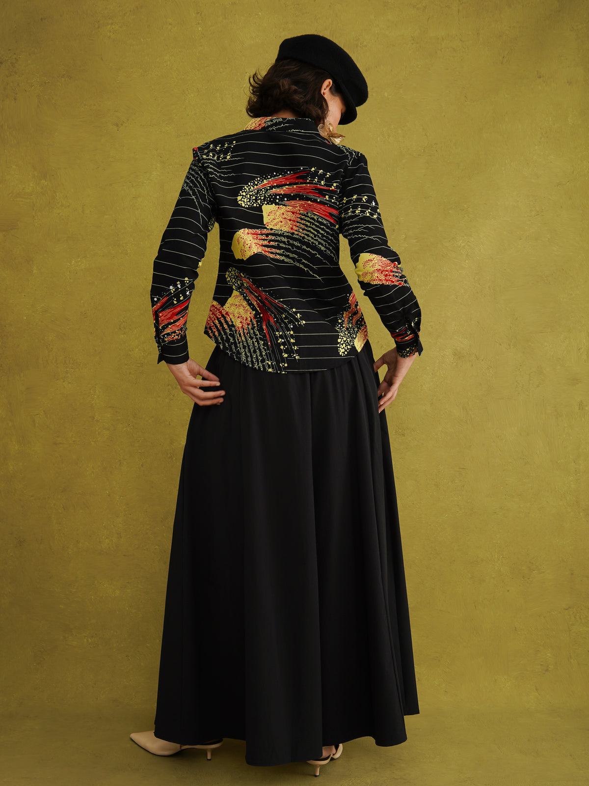 Ariya Adaze Shirt, a fitted shirt in red and yellow Fireworks print Dutch wax cotton on a blue background