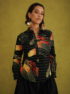 Ariya Adaze Shirt, a fitted shirt in red and yellow Fireworks print Dutch wax cotton on a blue background