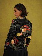 Ariya Adaze Shirt, a fitted shirt in red and yellow Fireworks print Dutch wax cotton on a blue background