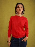 Titi Cardigan in Red, a relaxed-fit red knit cardigan with open-work and cable stitches and small buttons up to the neck