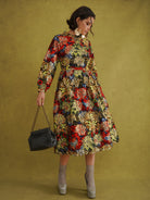 Commot for Road Golden Red Dress, black tropical wax print with gold metallic leaves, fitted bodice and gathered skirt
