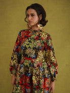 Commot for Road Golden Red Dress, red, yellow, green and blue tropical print on black with gold outlining the leaves